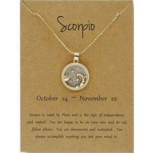 Golden necklace with sparkly Scorpio constellation pendant. Zodiac necklace